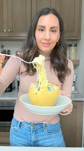 This is my favorite way to cut spaghetti squash to get long strands that actually look like spaghetti. You can stuff it with so many combinations like this creamy alfredo-like sauce made with butter, cream cheese and mozzarella cheese. | Feel Good Foodie