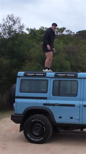 Josh McCallion on Instagram: "If you don’t know the story I’ll detail it briefly: Britain’s richest man (Jim) like Defender. Land Rover say we stop making OG Defender. Jim ask Land Rover for Defender making tools. Land Rover say no. Jim make new car. Land Rover say that look like Defender. Court say, no, it different. Jim happy. Car community happy. Josh stand on roof. Josh happy. Not sure why I wanted to test the load bearing roof but to be honest at this point I was so giddy that I was driving