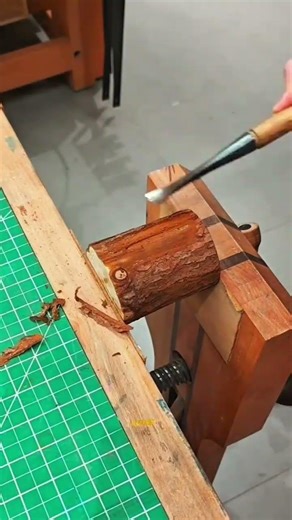 Removing the Bark from a Wood Log with a Chisel for Precise Woodworking Projects