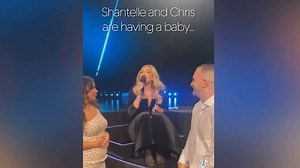 Adele gets emotional helping couple reveal gender of baby during concert