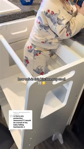 Cari Chapman | toddler + home finds on Instagram: "Comment SHOP and I’ll send you more info! the protective bar makes it safe so baby can’t easily fall out. I stay close by typically, just to be safe! My babe is wobbly sometimes but has never fallen. #kitchenstepstool #stepstool #kitchenhelper #toddlermusthaves #toddlermomlife"
