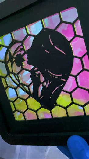 OtticVision Studio on Instagram: "Turning a simple 3D print into shifting light This is what happens when you combine FDM printing with dichroic film. The film refracts light into different wavelengths depending on the angle, pure physics. Materials: • 3D printed silhouette (PLA) • Dichroic vinyl film • Black frame #3dart #satisfying #diyart #artoftheday #homedecor"