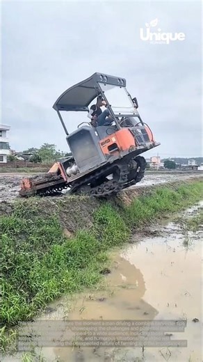 Combine harvester fail: combine harvester tips over into muddy ditch