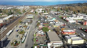 Aerial clip of Kent Station, a shopping area downtown Kent in the Green River Valley near East Hill, Scenic Hill, Auburn, Renton, Federal Way, all suburbs of Seattle, King County Washington