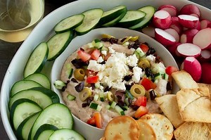 This Healthy Mediterranean Dip is reminiscent of the classic 7 layer dip. Made with white beans to make a hummus style base with all the fresh toppings that make you feel like you’reon a Greek Island! Great for game day for health conscious snacking! Full Recipe: https://www.westviamidwest.com/mediterranean-dip/ | West Via Midwest