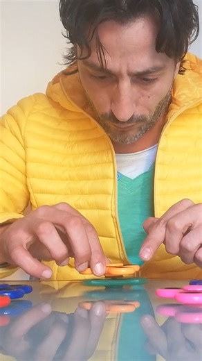 708K views · 2.7K reactions | Throwback: Tallest tower of fidget spinners built in one minute - Rocco Mercurio  | Guinness World Records | Facebook