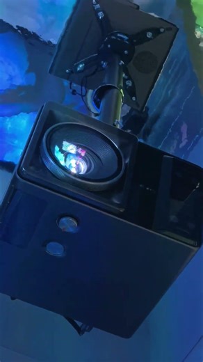 Hisense XR10 projector featuring automatic lens shift with distortion‑free image alignment.