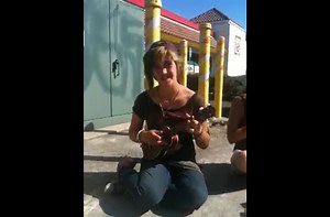 Young girl is an old soul on an ukulele.