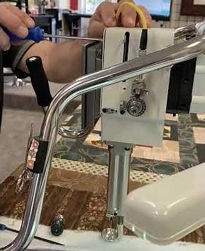 Mike and Renae get ready to install a High Performance Tension Assembly for the INNOVA longarm