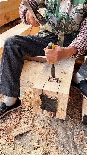 Carving square mortise in timber using chisel and mallet