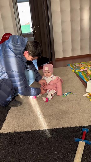 Fun Moments: Child Getting Dressed with Help