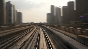 Time Lapse of Railroad Travel Rushing Fast with Speed in Futuristic Cityscape Skyline
