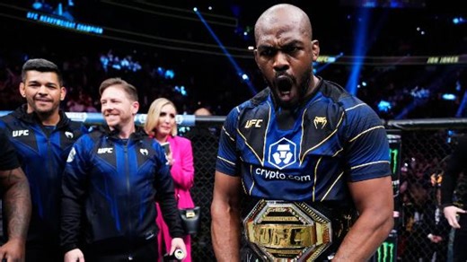 Jon Jones celebrates after first-round submission of Ciryl Gane