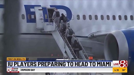 IU football team boards plane in Indianapolis for College Football Playoff National Championship in Miami