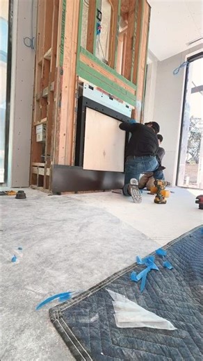 Custom patina steel cladding for fireplace.