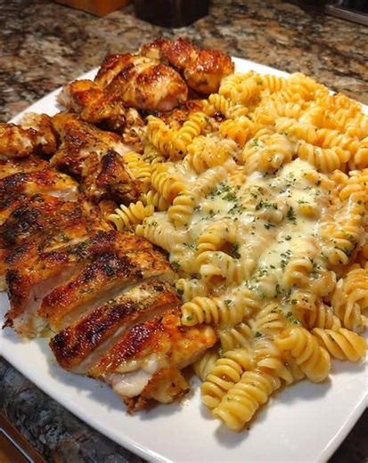 Creamy Velveeta Chicken Rotini with Mozzarella Garlic Sauce: A Cheesy Pasta Favorite "Last night, as I stirred the pot, the rich aroma of garlic and melted cheese filled our kitchen, and my kids couldn’t wait to dive in. This dish has officially become our family’s go-to comfort meal!" This Creamy Velveeta Chicken Rotini with Mozzarella Garlic Sauce is a delightful blend of flavors that turns any dinner into a cheesy celebration. Ingredients 1 lb rotini pasta 2 cups cooked, shredded chicken 8 oz