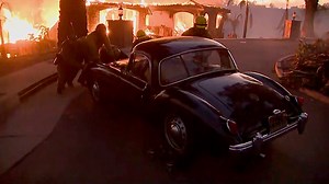 Fierce wildfire near L.A. destroys homes, forces thousands to flee