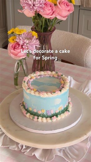 Let’s decorate a Spring cake with clouds and buttercream flowers🌸☁️🩵 #cake #cakedecorating #spring