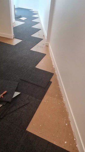Installing Dark Gray Carpeting in Hallway
