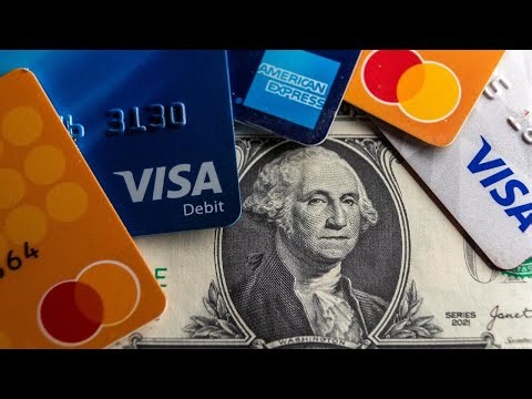 Record number of Americans carrying credit card debt they can't pay off, report shows