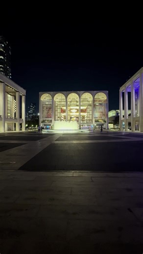 Standing in front of the Lincoln Center in New York, State Of New York, a beautiful vision unfolded before my very eyes and lenses. A couple, playing in front of the fountain, their silhouettes posing in the distance with a Lincoln Center background to boot. Zoomed out, after they stopped posing and playfully enjoying their time, and took a quick look around the perimeter of Lincoln Square, not awfully far from Times Square, New York City. Love this view! #LincolnCenter #fountain #sillouette #si