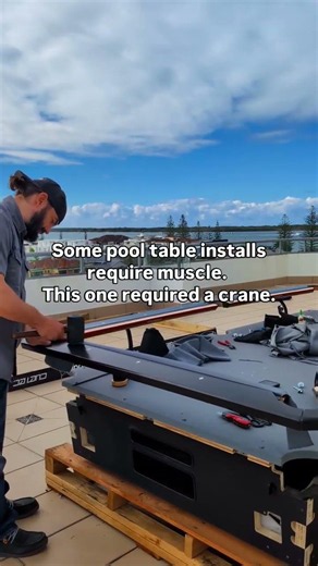 some pool table installs require muscle. this one required a crane