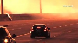 Drivers who somehow entered the southbound 110 Freeway in downtown L.A. early Monday faced a hellish scene: a massive apartment complex under construction in towering flames over the roadway. The fire was so powerful it blew out the windows on surrounding buildings, and firefighters were showered with glass as they worked in intense, reflected heat to knock the flames down. Arson investigators are working the case. Read KTLA’s story here: http://ktlane.ws/1G6CpSi | KTLA 5 News
