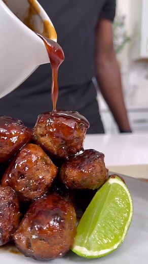 Jerk BBQ Meatballs for gameday! Ingredients ﻿﻿1/2 Ib Ground Beef ﻿﻿1/2 Ib Ground ﻿﻿Pork ( Can sub out either for ground turkey) ﻿﻿1 bell pepper, diced ﻿﻿1/2 large yellow onion ﻿﻿1 large egg ﻿﻿Ginger paste ﻿﻿Garlic paste ﻿﻿Cilantro paste ﻿﻿2 tsp jerk seasoning ﻿﻿1 1/2 tsp all purpose seasoning ﻿﻿2 tsp freshly grated carrot ﻿﻿1/2 cup Pablo bread crumbs ﻿﻿2 Tbsp Avocado oil ﻿﻿2 Tbsp unsalted butter ﻿﻿Fresh chopped chives for garnish ﻿﻿Shredded carrot for garnish ﻿﻿Lime wedges for garnish Jerk BBQ S