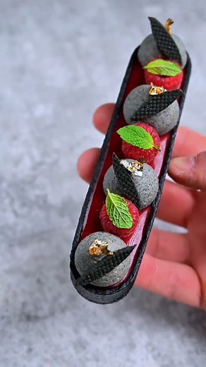 A sublime fusion of black sesame and raspberry with this delicious tartlette by @andrea.petreri ❤️ The black sesame adds a nutty depth that perfectly complements the sweet raspberries for a truly unique and delicious dessert! 🥰 . . . #pastryart #pastrychef #chef #pastry #pastryporn #pastrychefs #pastrychefsofinstagram #pastrycheflife #pastrylove #pastrylover #pastrypassion #pastrylife #pastryarts #pastryinspiration #instapastry #patisserie #patisseries #dessert #desserts #dessertporn #dessertpi