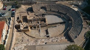 ancient Roman amphitheatre in Tarragona, Spain, old ruined coliseum, antique architecture, aerial drone view 4k