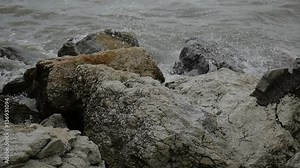 Slow motion storm waves blown by the wind