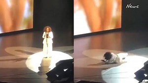 Oprah Winfrey stumbles and falls on stage while delivering motivational speech