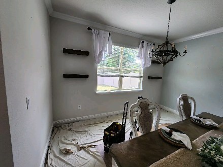 This dining room wainscoting project is complete! Love the way the board and batten transformed this room! | McKinnon Building Services LLC | Facebook