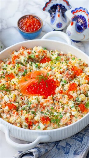 Tatyana Nesteruk on Instagram: "Olivier Potato Salad is an iconic and delicious salad served at Slavic holiday parties! We always have this salad for Christmas! My version with smoked salmon and a creamy lemon dressing is a delicious twist on the classic recipe. With smoked salmon, eggs, potatoes, capers, and lots of lemon zest. This salad has quickly become a family favorite for the holidays! Get all the recipe details and watch my full-length YouTube video tutorial on my website! https://tatya