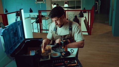 clip-3997801675-crafting-assembling-tools-modern-workspace-during-morning