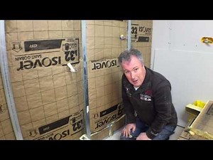 Installing insulation and placo in the workshop