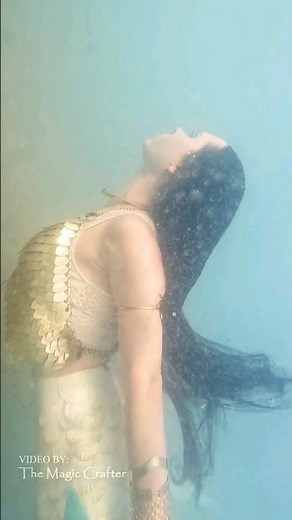 mermaid woman sparkles and shines underwater