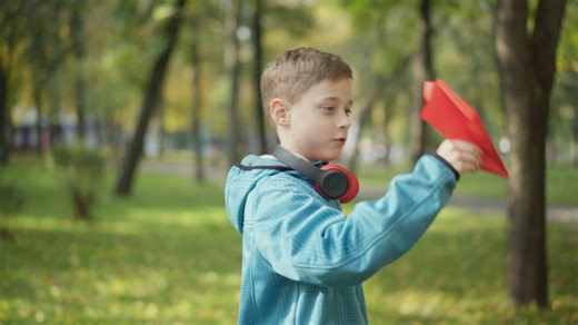 Having fun with a red paper plane  - Free Stock Video