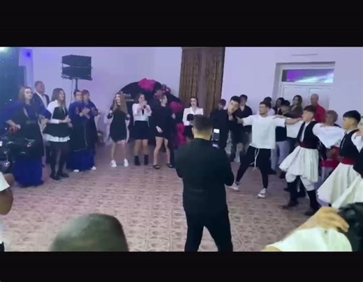 Traditional Romanian Dance at a Wedding Celebration