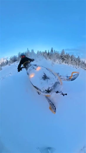 Rocks and trees and WATER. Early season snowmobiling