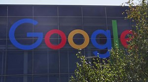 Download Close up of the Google logo sign on the building in Mountain View, California. Google LLC is an American multinational technology company.
