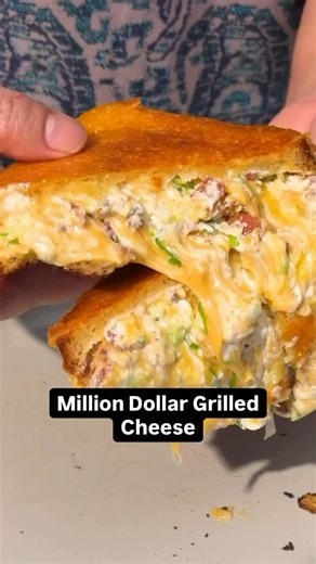 No more ordinary grilled cheese sandwiches. 🙌 🥪 This Million Dollar Grilled Cheese is crackly bacon, molten cheese, and pure million dollar crunch! 🤤 Get the full recipe below or in the @allrecipes bio. 🥓🧀 Ingredients: 1/2 cup mayonnaise 2 cloves garlic, grated, divided 8 (1-ounce) slices hearty white bread 1 (8-ounce) package cream cheese, softened 1 cup thinly sliced scallions (about 4) 3/4 cup chopped cooked bacon (from 8 slices) 3 cups shredded sharp Cheddar cheese, divided 8 (1-ounce) 
