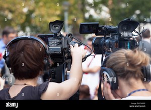 News conference. Filming an event with a video camera Stock Photo - Alamy