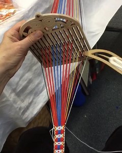 Bandweaving with a double holed heddle