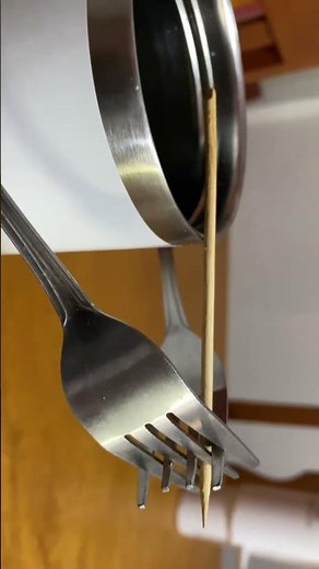 Physics Experiment demonstrating the application of center of mass. (stick and forks)