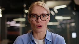 Amazed woman in casual outfit staring at something unbelievable on...