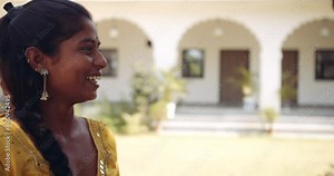 Two females and two males arguing pointing fingers blaming each other in a heated debate discussion angry fighting in open front of building exterior, panning from one group to another