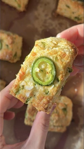 Pillowy flaky biscuits that only take 30 minutes to make. Crumbling your butter in your flour is the key! Thanks @groovyfoodiess for the ultimate game day snack. Find the recipe on Tasty.co or here: https://tasty.co/recipe/cheddar-jalapeno-scallion-biscuits | Tasty