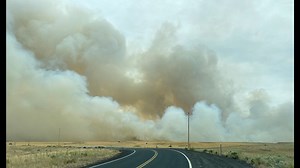 Spread of wildfire near Mansfield slows as crews work to put out hot spots