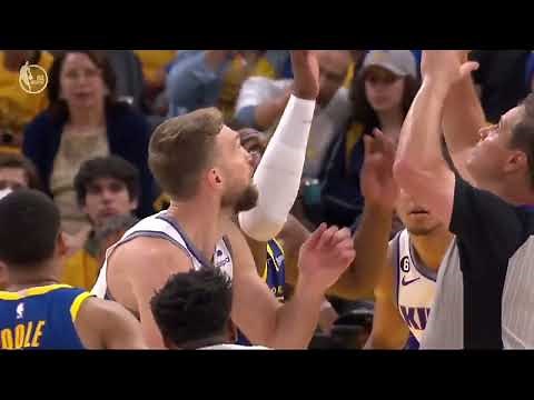 Domantas Sabonis Takes a Shot to the Face from Kevon Looney